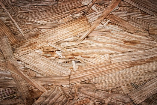 Background image of the rough surface of a wooden board glued together from a piece of wood. High quality photo