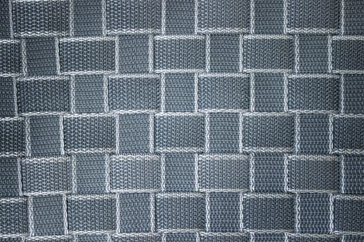 Woven surface of propylene tape, textured gray-blue background. High quality photo