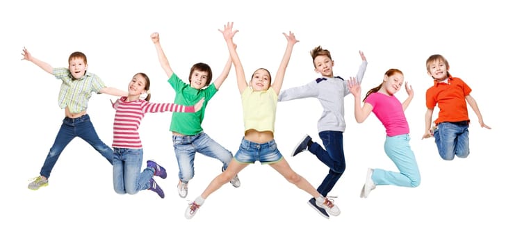Group of happy, cheerful children jumping at isolated white studio background. Childhood and freedom, active lifestyle concept, copy space