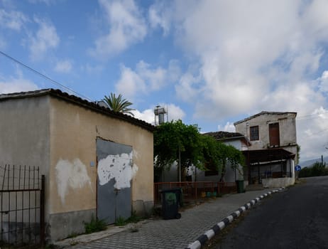 Authentic Cypriot architecture in the historic town of Lefke, Cyprus, featuring whitewashed walls and wooden details.