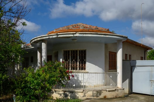 Authentic Cypriot house in Lefke with white walls, wooden balcony, and old-style charm typical for Mediterranean towns.