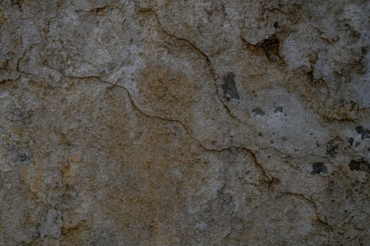 Close-up of a gray rough concrete wall, perfect as a neutral background or texture in design projects.