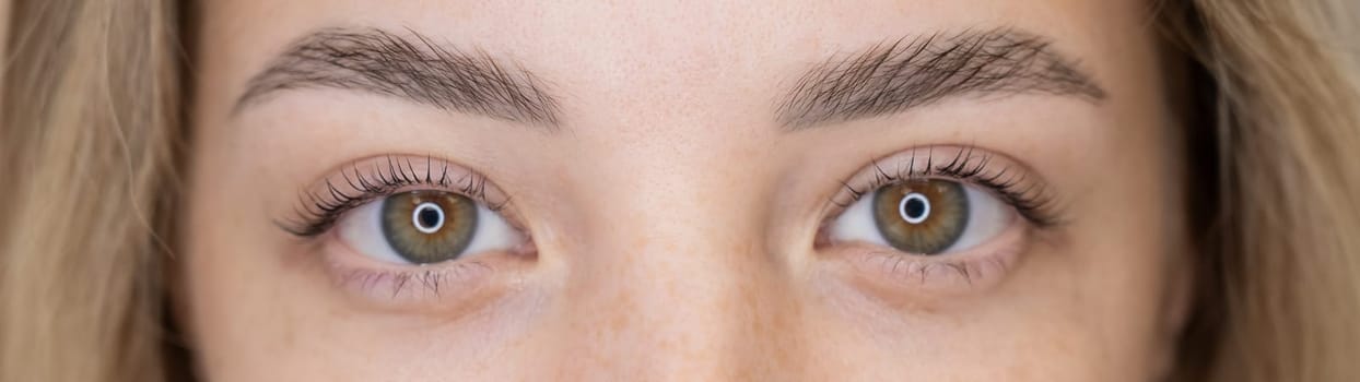 Close-up portrait of a woman after eyelash lamination procedure