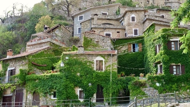 A beautiful medieval village in the Ligurian mountains called Castelvecchio di Rocca Barbena with stone buildings and cobblestone roads