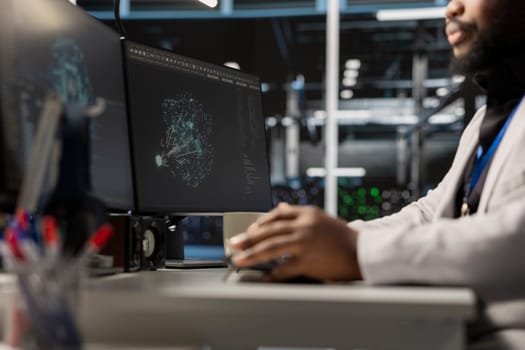Close up of programmer in data center using AI powered tech to run simulations. IT expert coding cognitive computing algorithms to extract insights from data and automate rigs