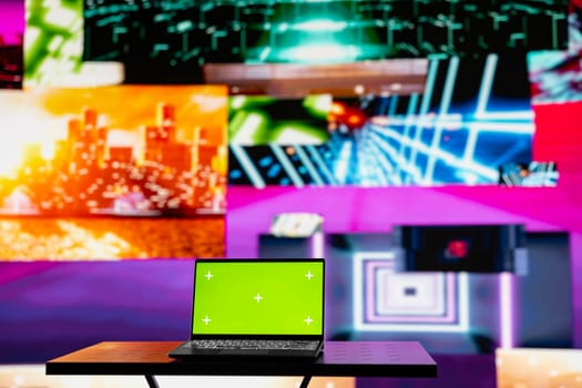 Empty scene with a pc showcasing copy space display next to artistic lights, creating a soundscape for nightlife ambiance and music culture. Spreading the visual art vibes and creativity.