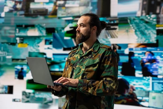 Male soldier operates in a virtual war zone using digital technology and threat detection tools, showcasing modern military strategy. Ensuring secure communications in active operations.