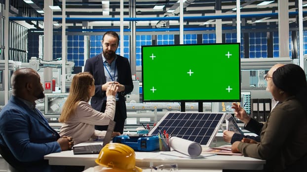 Factory engineers use isolated screen monitor to check solar panel materials parameters, improving durability. Researchers develop sustainable energy solutions, looking at chroma key display, camera A