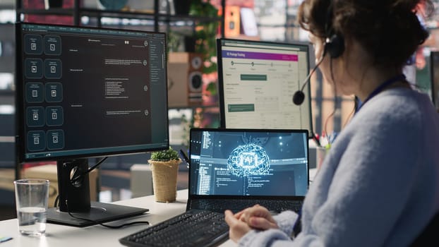 Worker providing live chat support, typing on keyboard, using AI chatbot to handle clients complaints. Call center agent dealing with unsatisfied customers using artificial intelligence LLM, camera A