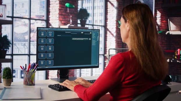 Focused woman working with an AI chatbot on her desktop computer, offering real time assistance and powerful online tools. Advanced system displays how machine learning provides support. Camera B.