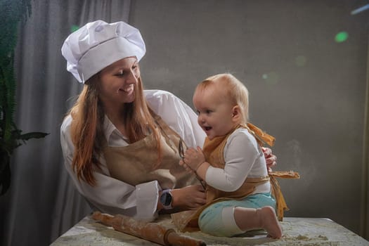 A mother and daughter joyfully engage in a flour-filled moment, creating memories in a cozy kitchen setting.