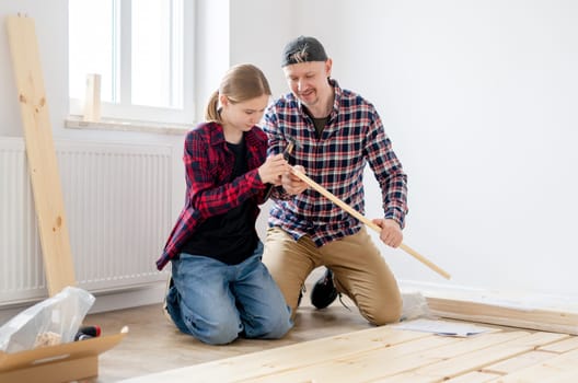 Dad And Daughter Building A Table At Home