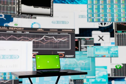 In a business finance space, laptop showing isolated chroma key to help the strategy planning with financial data. Representing high tech artificial intelligence and productivity for growth.