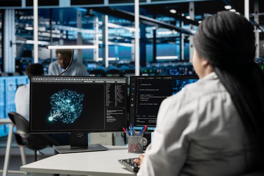 Data center computer scientist at work using machine learning algorithms to analyze datasets. Server room staff member using artificial intelligence to recognize data patterns