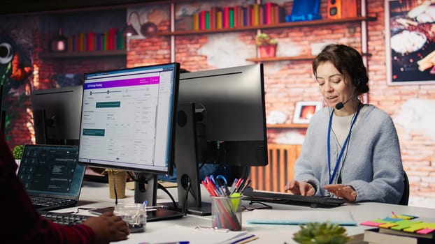 Team of call center agents tracking shipments in office, solving tasks. Customer center staff members use software on PC to locate clients packages and provide status updates