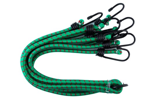 Set of green bungee cords with black metal hooks, coiled together and secured for transport. Elastic tie down straps on white background.