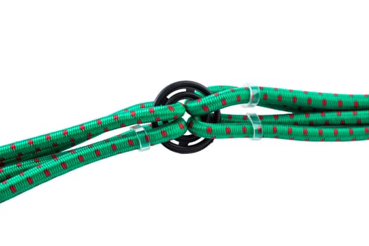Close-up of plastic ring holding several green bungee cords with metal hooks. Durable gear organizer on white background for automotive and outdoor use.