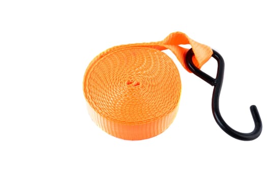 Bright orange cargo strap with a metal hook and ratchet, isolated on white background. New equipment used for securing loads or for transport.