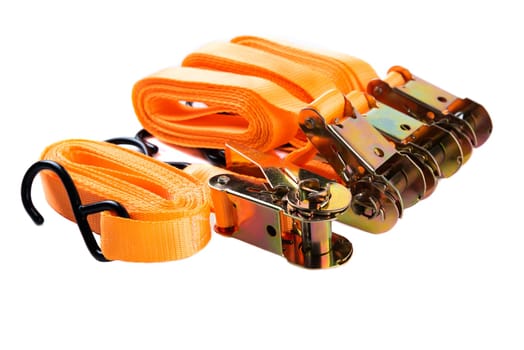 Side view of four orange cargo tie-down strap sets with hooks and ratchets, lined up neatly on white background. Ideal for promotional or e-commerce use.