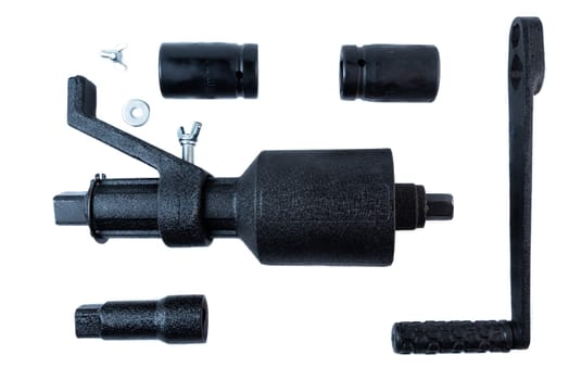 Disassembled manual impact wrench tool kit with handle, sockets, fasteners, and drive mechanism on white background