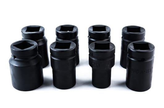 Vertical arrangement of impact sockets in assorted sizes on white background, designed for heavy-duty automotive work and mechanical applications.