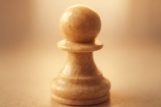 Polished Marble Chess Pawn Macro with Warm Pastel Tilt-Shift Blur