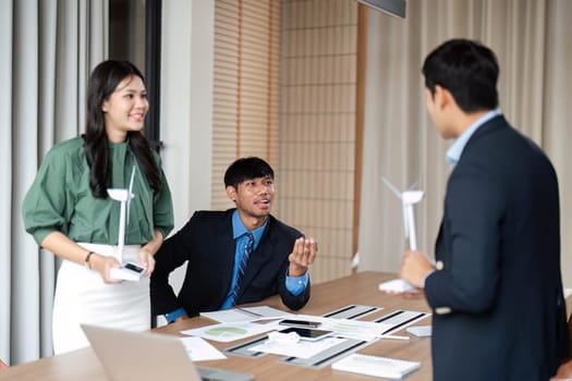 Professionals discuss and present ESG strategies, focusing on sustainability and responsible governance in a collaborative environment.