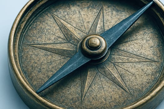 Macro of Vintage Brass Compass Needle under Cool Pastel Light