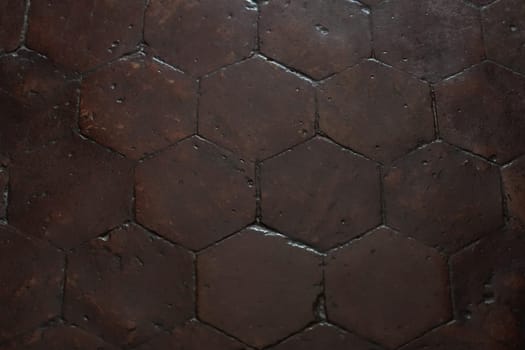Hexagonal vintage antique brown tile in a french old manor Banner