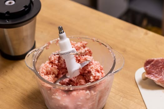 Just ground meat mince in the glass ball of the electrical chopper on the kitchen counter top