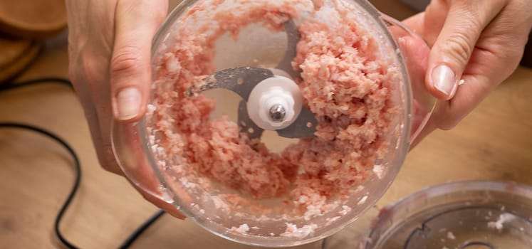 Just ground meat mince in the glass bawl of the electrical chopper on the kitchen counter top