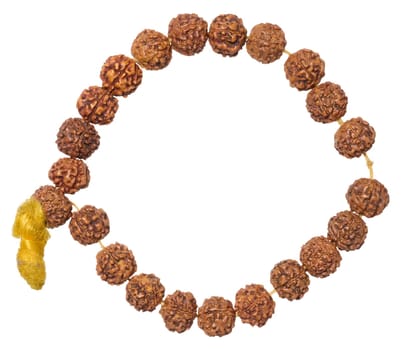A Rudraksha bracelet made of brown beads with a yellow tassel, forming an open circle, isolated background