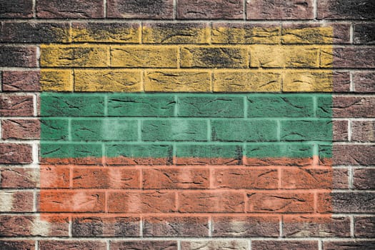 A Lithuania flag on brick wall background
