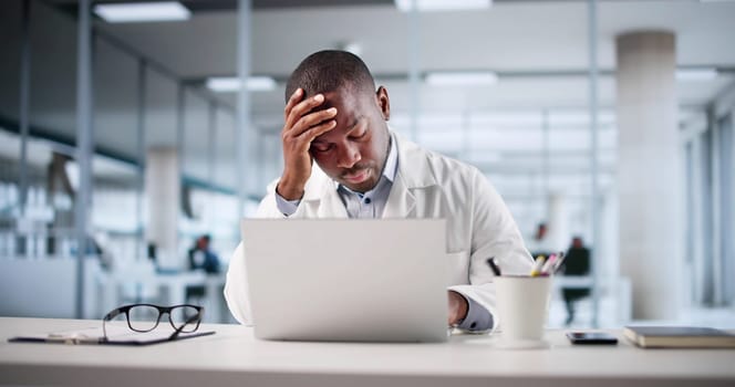 Concerned African American Doctor Stressed Over Patient's Test Results, Tired