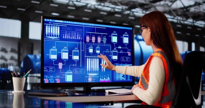 Female Engineer Monitoring Turbine At Gas Power Plant Facility