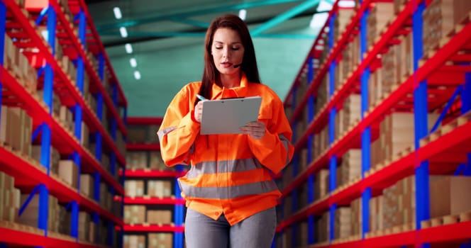 Professional Woman Managing Warehouse Inventory And Coordinating Deliveries To Customers.
