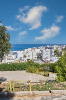 Rodas.Greece - june 07, 2025:  Idyllic summer setting in a charming Greek island town, showcasing architectural diversity and natural beauty from an elevated viewpoint, with the sparkling