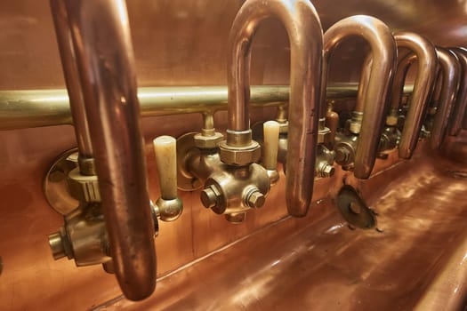 Brewery tanks, pipes and taps traditionally made of copper and brass, beer production