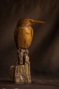 Sculpture of a Kingfisher in three metals.