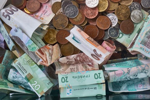 Pile of Czech Crown CZK money banknotes and coins