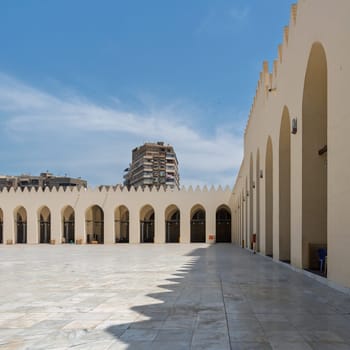 The Mosque of al-Zahir Baybars in Cairo, Egypt, boasts architectural splendor that reflects the city's rich history and cultural heritage. The azure sky harmonizes with the mosque's intricate design