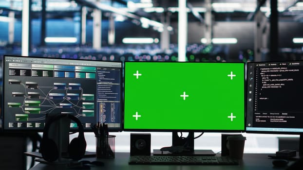 Mockup computers in data center facility manage supercomputers hardware energy consumption through node tree software. Green screen PCs automate server farm processes using visual programming tool