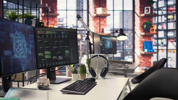 Empty office desk with computer screen showing terminal windows and network neurons. AI powered system uses cognitive computing and pattern recognition for futuristic software solutions.