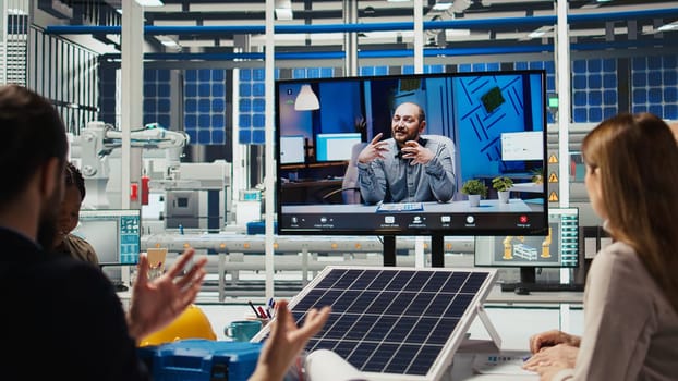 Photovoltaics plant researchers doing online videocall to optimize energy production. Solar panels plant specialists developing innovative manufacturing tech during remote teleconference, camera A