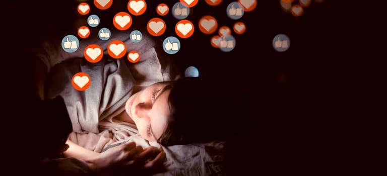 Young girl lies in bed at night with a mobile phone and sends or receives likes and hearts on social networks, a woman publishes news, the symbols of hearts and likes are added over image.