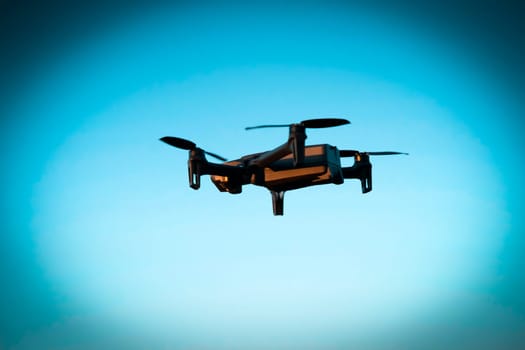 Drone flies in the sky, developing UAVs and new technologies for security check missions, search and rescue, hobby, and industrial fields.