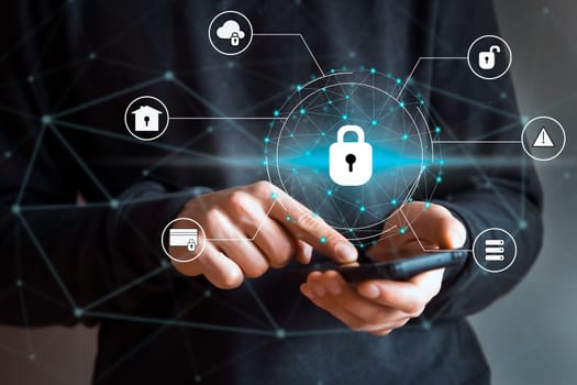 Man holds a mobile phone in his hands, uses the app and makes additional protection, sets passwords for his data, safe use of the device for business and personal communications, closeup with icons.