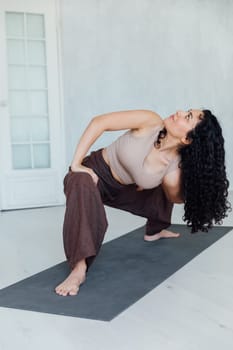 sports fitness woman brunette doing gymnastics yoga asana sport