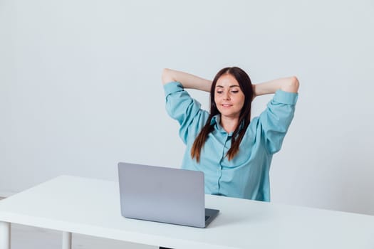 Business brunette woman working on laptop at office desk online