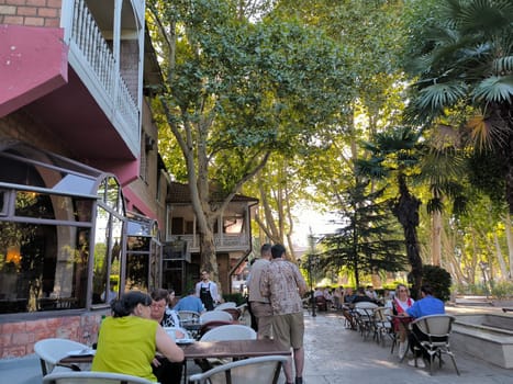 Tbilisi Georgia Europe August 16 2024 , Outdoor café seating people travel tourists tourism shotlisttravel place destination objects perfect performance person editorial street outdoor town city centre . High quality photo